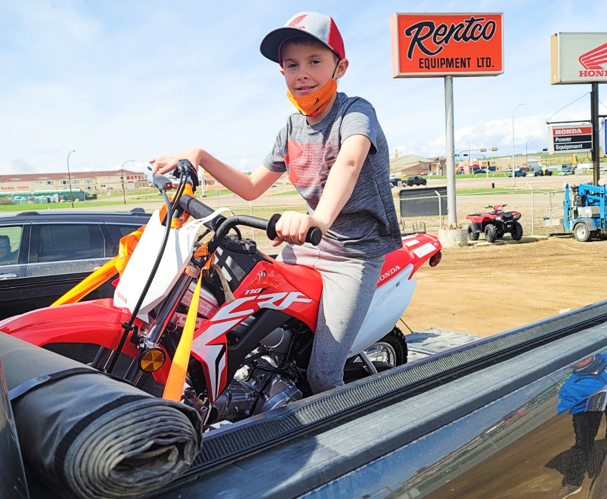 Happy Customers Loading His New Ride